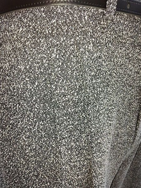 Close-up of a textured surface of speckled trousers