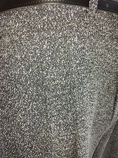 Close-up of a textured surface of speckled trousers