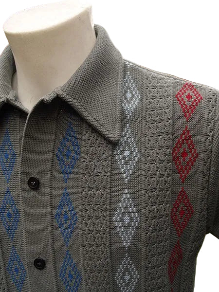 Gray knitted vest with geometric pattern on a mannequin against a blurred outdoor background