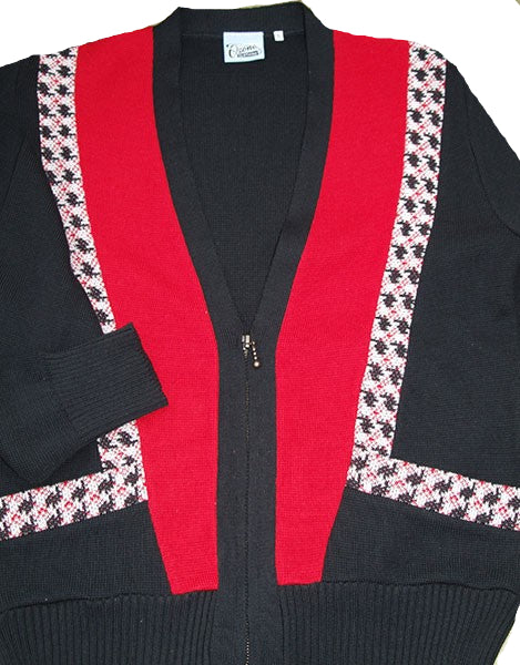 Black cardigan with red accents and patterned trim on a beige background