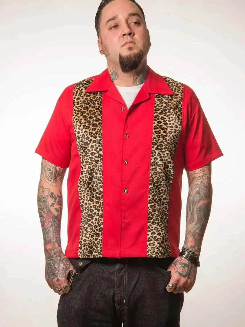 Man wearing a red shirt with leopard print panels on a white background