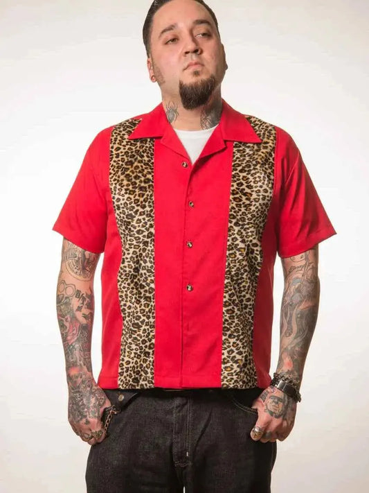 Man wearing a red shirt with leopard print panels on a white background